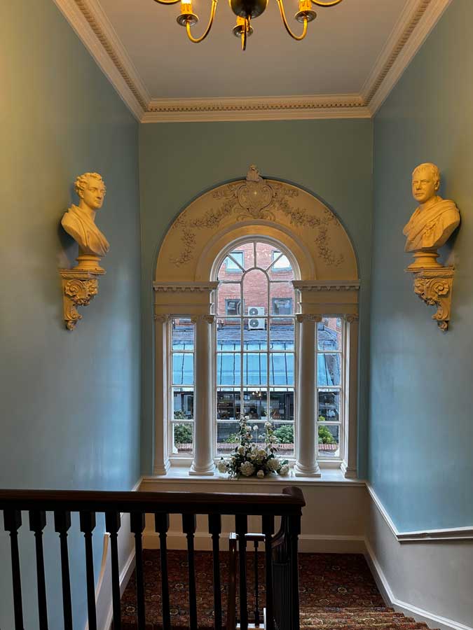 Stairs leading from the dining room to the entrance hall